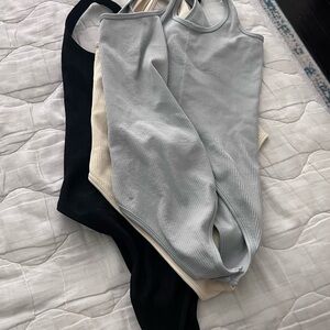 OQQ Black, cream and light grey bluish color . 3 Ribbed Tank Tops. Never worn